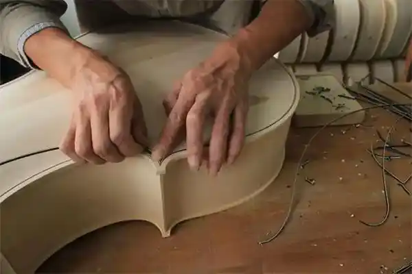 Edge finishing and body detail work for violin family instruments