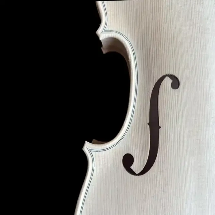 Close-up detail of the hand-carved F-hole and inlaid purfling on unfinished violin model LVW-03. Showcasing fine-grain spruce top and professional woodworking for luthier wholesale.