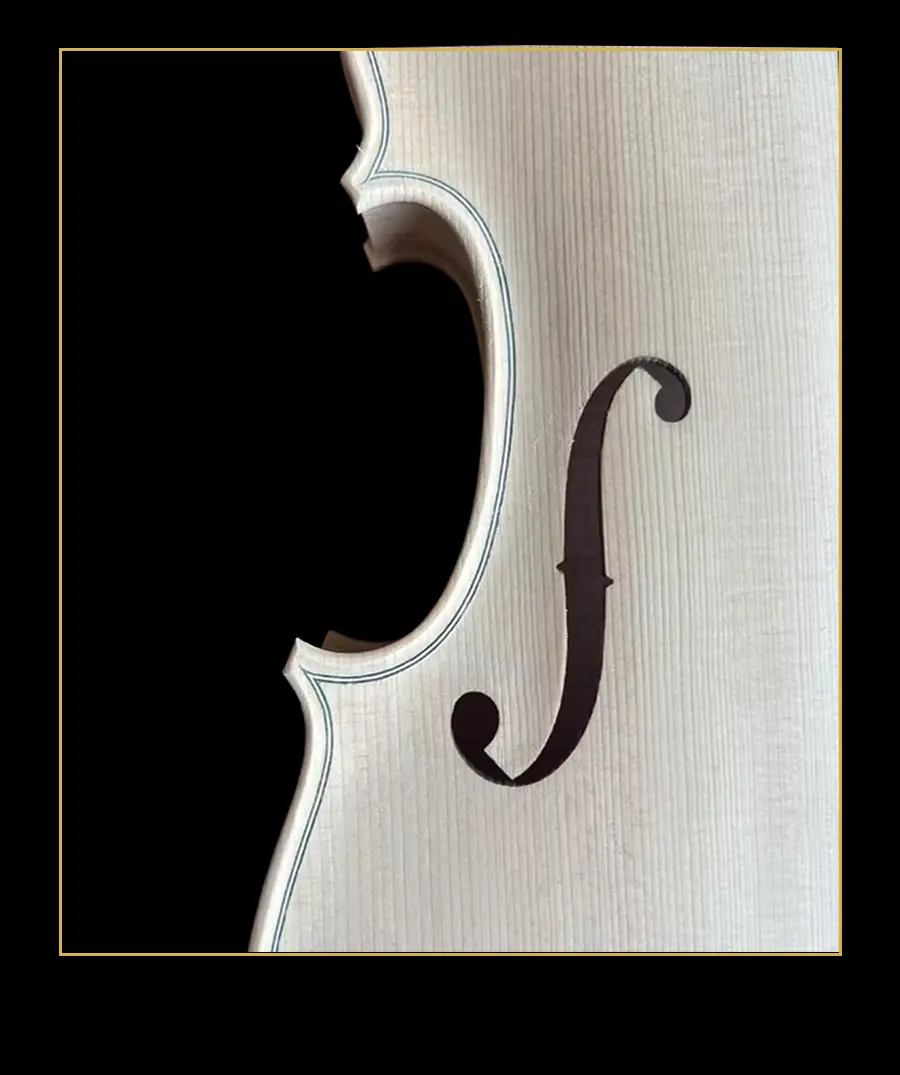 High-resolution framed close-up of the hand-carved f-hole and inlaid purfling on the unfinished violin LVW-03. Showcasing fine-grain spruce top quality for wholesale.