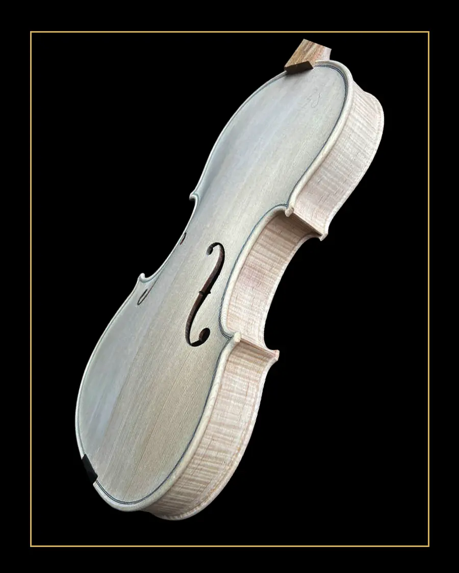 Framed side angled view of the unfinished solid wood violin model LVW-03, showing flamed maple ribs and professional hand-carved body. Factory direct luthier supply.